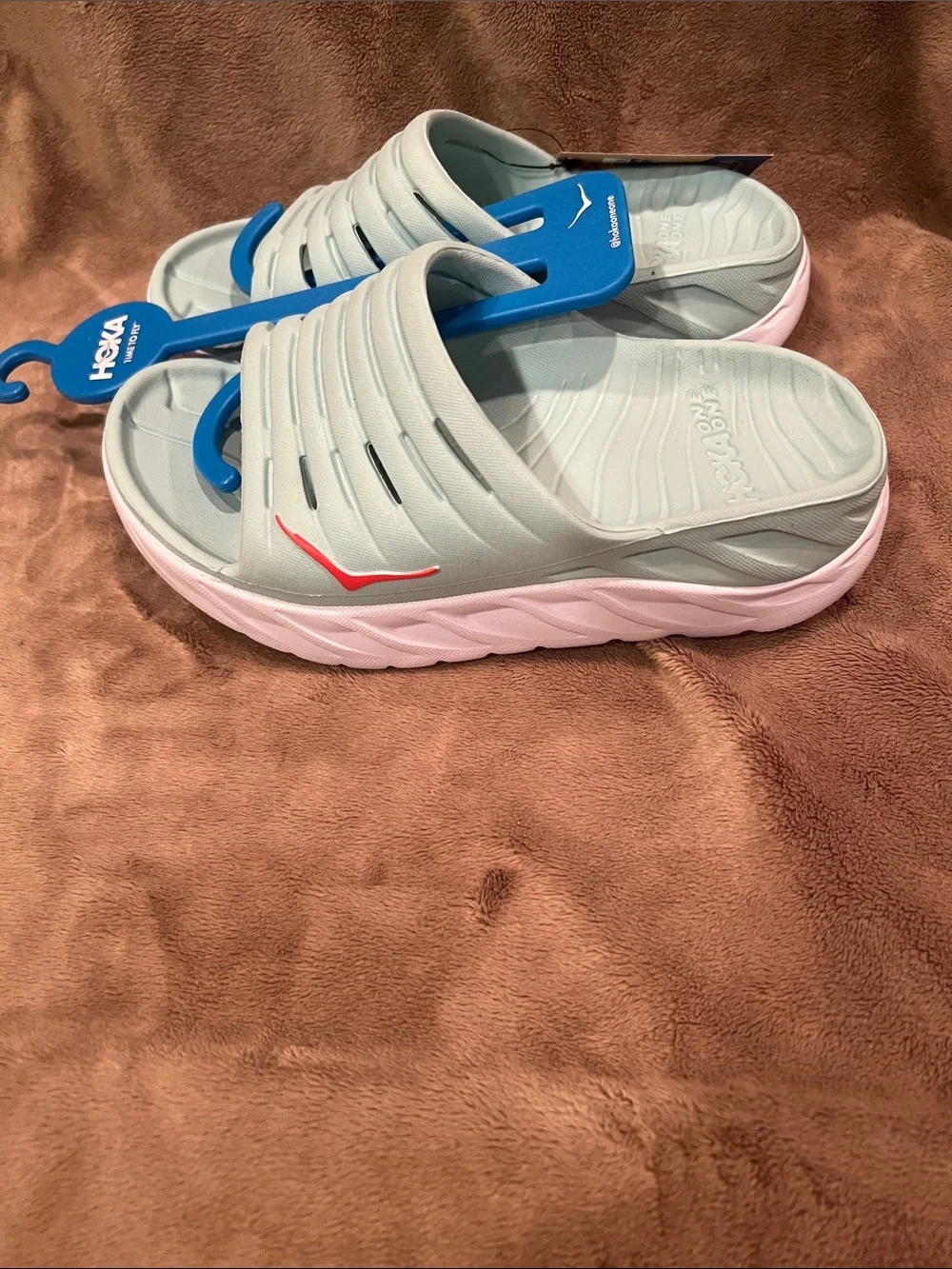 Hoka Slide Sandals in Light Egghell Blue with Pink Accent